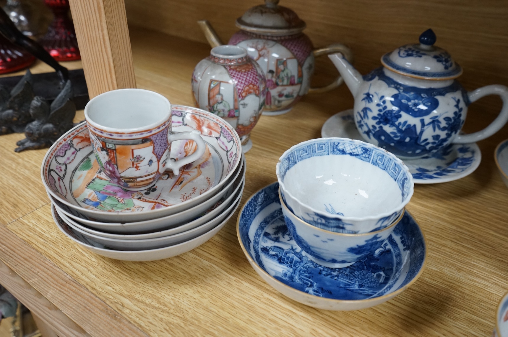 A group of 18th century Chinese export porcelain tea and coffee ware, including Mandarin pattern teapot and cover, two coffee cups and saucers, a blue and white teapot and cover various famille rose coffee cups, etc.